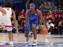 Mar 11, 2026; Charlotte, NC, USA; Southern Methodist University Mustangs guard Jaron Pierre Jr. (5) dribbles during the second half against the Louisville Cardinals at Spectrum Center